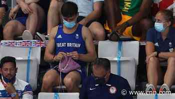 Diving champion Tom Daley says he was knitting a dog sweater during women's final
