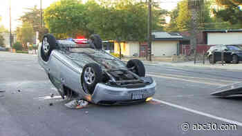 Car flips after hitting parked vehicle in central Fresno