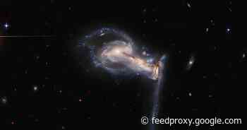 NASA Hubble Space Telescope snaps 'squabbling galactic siblings'     - CNET