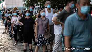 China moves to quash rising Covid cases with mass domestic travel restrictions