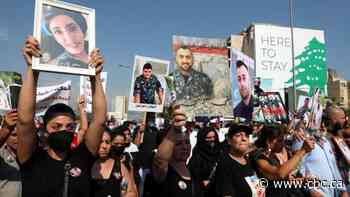 Thousands of Lebanese call for justice 1 year after massive explosion
