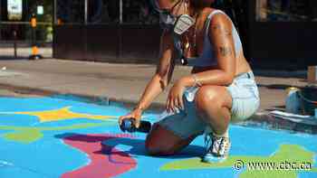Artists paint their vision of the future with Baldwin Street mega-mural