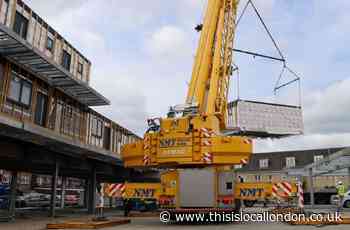 Burnt Ash Lane: Factory-built homes lifted onto site by crane