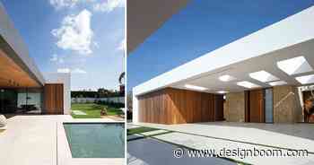 binomial architecture designs modern home characterized by three main white volumes - Designboom