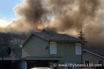 Surrey crews battling ‘stubborn’ apartment fire in Newton - News 1130
