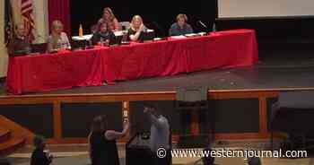 Watch: After Describing Homeland 'Ravaged by Communism,' School Board Compels Police to Remove Woman