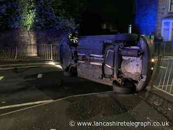 Man arrested on suspicion of drug driving as car overturns