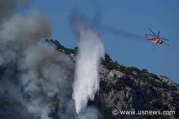 Wildfires Rampage in Greek Forests, Cut Large Island in Half