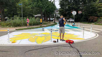 Friendship Intersection Closed While Artists Install Asphalt Art