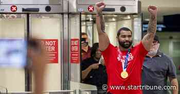 Gophers' wrestler Gable Steveson returns with giant smile, Olympic gold to celebratory crowd at MSP airport