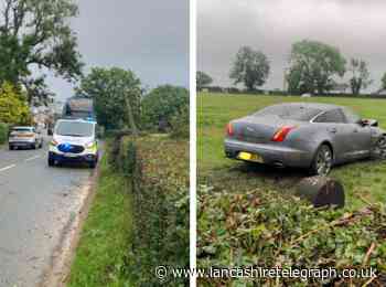 Preston Road blocked as Jaguar crashes through fences and lands in field