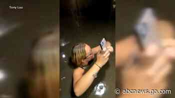 WATCH:  Friends rescued from flooding elevator during storm
