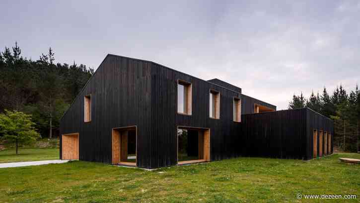 Caserío Azkarraga is a restaurant and residence wrapped in blackened timber