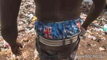 'It's an insult': In an African clothing market, a bale of used clothes donated by Australians is opened