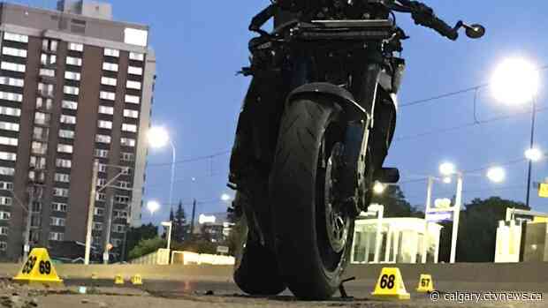 Woman dead, man hospitalized after motorcycle strikes pedestrian along Memorial Drive