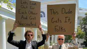 Biden promotes vaccines with 'Dude With Sign'
