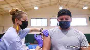 More U.S. cities enact proof of vaccination rules; Moscow, Tokyo set COVID-19 records