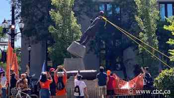 Sir John A. Macdonald statue toppled in Hamilton park after hundreds attend rally, march