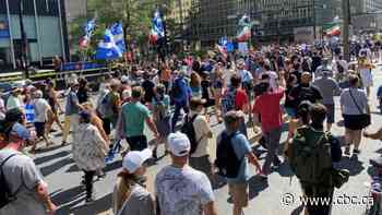 Large crowd marches in Montreal to protest against Quebec's vaccination passport