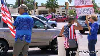 Hundreds gather outside of Tucson Medical Center protesting mandatory vaccines - KOLD