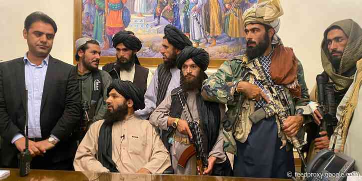 Striking photos and video show Taliban fighters holding guns and reciting from the Quran inside Afghanistan's presidential palace