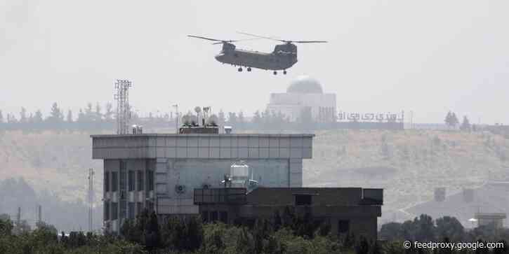 This striking photo was taken as the US rushed to evacuate its embassy in Kabul, which some critics are calling Biden's 'Saigon moment'