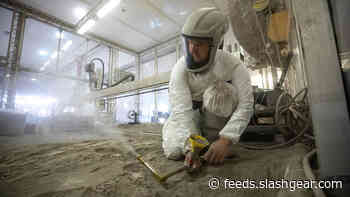 NASA scientists play in 16 tons of simulated lunar regolith