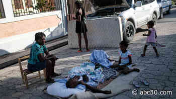 Earthquake victims wait for help as new disaster overwhelms Haiti