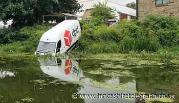 Pendle: DPD van driver rescued by firefighters after driving into canal