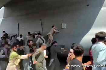 Video Shows Desperate Afghans Climbing US Jet to Escape
