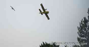 Authorities attack Minnesota wildfire from air and ground