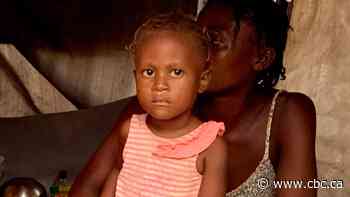 Visit a makeshift camp for earthquake victims in Haiti