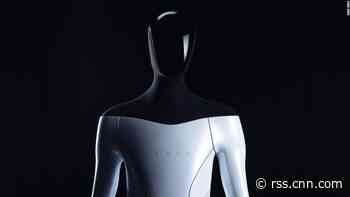 Elon Musk just added a robot to his list of things always coming 'next year.' For now he's got a guy in a suit