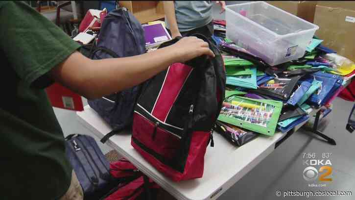 Salvation Army Homewood-Brushton Worship And Service Center Holding Backpack Giveaway