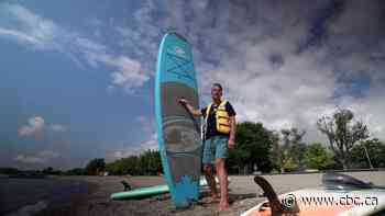 Toronto man with disability paddleboarding across Lake Ontario for youth mental health - CBC.ca