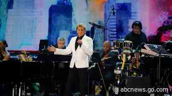 Henri cuts short Manilow set at NYC virus recovery concert