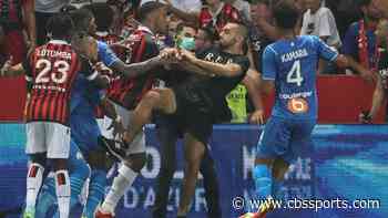 French soccer match suspended as Nice fans storm field following bottle-throwing incident with Marseille star
