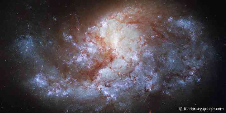 NASA says its Hubble telescope captured a spiral galaxy that's as bright as a jewel and 68 million light-years from Earth