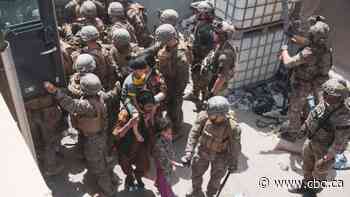 Gunfire at Kabul airport kills 1 amid chaotic evacuations