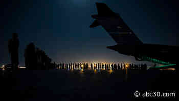 Gunfire at Kabul airport kills 1 amid chaotic evacuations