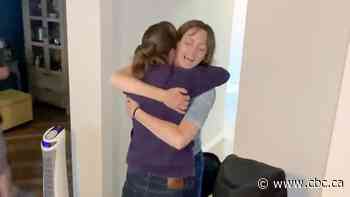 Watch the moment two friends finally hug after a year separated by border restrictions