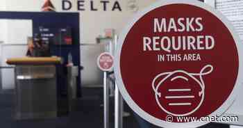 Delta Air Lines to charge unvaccinated employees more for company health care     - CNET
