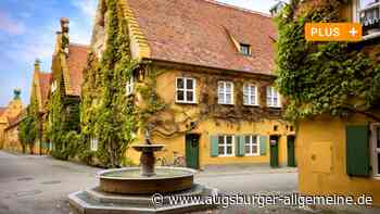 Touristen und die Frage nach der Religion: Ist die Fuggerei noch zeitgemäß?