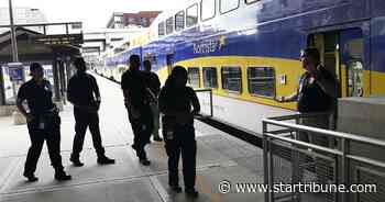 Group studying safety aboard Metro Transit trains, buses