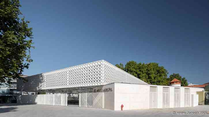 Triangular-patterned canopy shelters stalls at modernised Portuguese marketplace