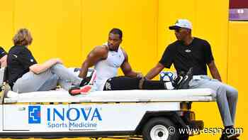 Ravens' Dobbins carted off with left knee injury