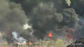 Selma fire destroys building and multiple trailers; firefighter suffers heat-related injuries