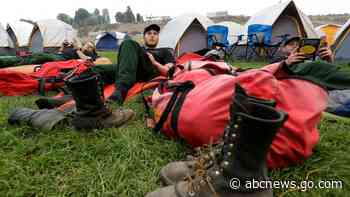 EXPLAINER: How wildfire camps keep crews ready for battle