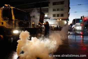 Greek police fire tear gas as 7000 protest coronavirus vaccine rules - The Straits Times