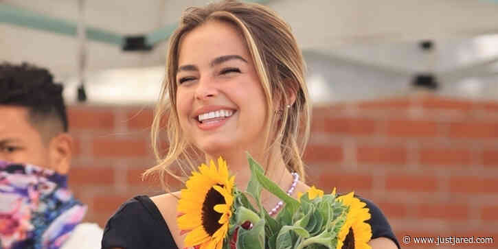 Addison Rae Picks Up A Bouquet of Flowers After 'He's All That' Premiere